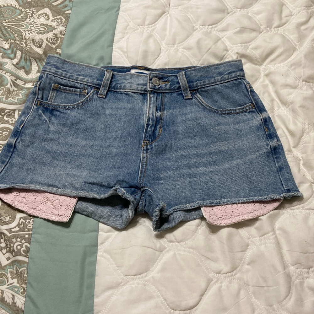 Kids 16, women’s 4 Jean shorts with pink crochet pockets